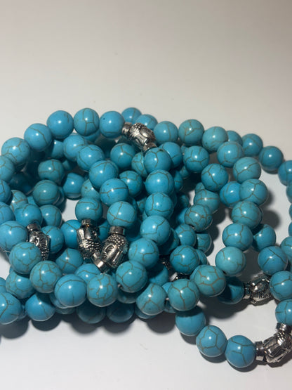 Armband ronde kralen met boeddha sluiting  in zomerse stijl turquoise